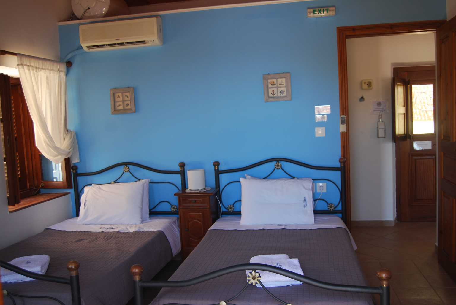 villa elena second bedroom two single beds with airconditioning