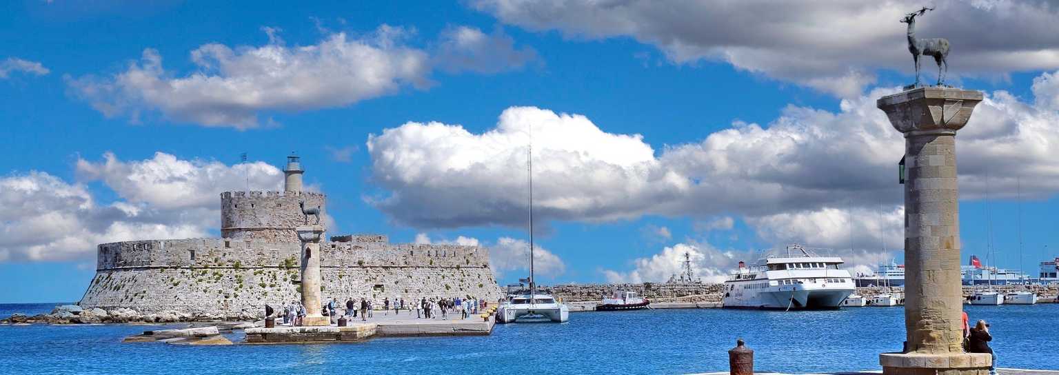 rhodes port lighthouse and deer statues