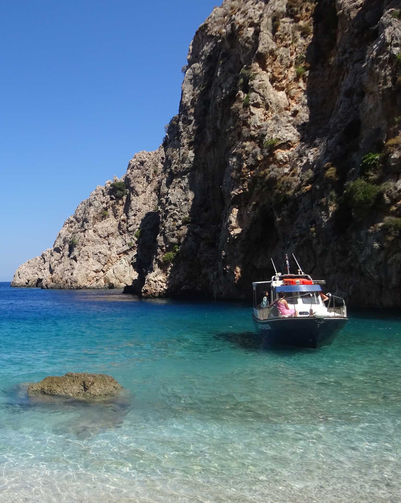 chalki areta beach view with boat