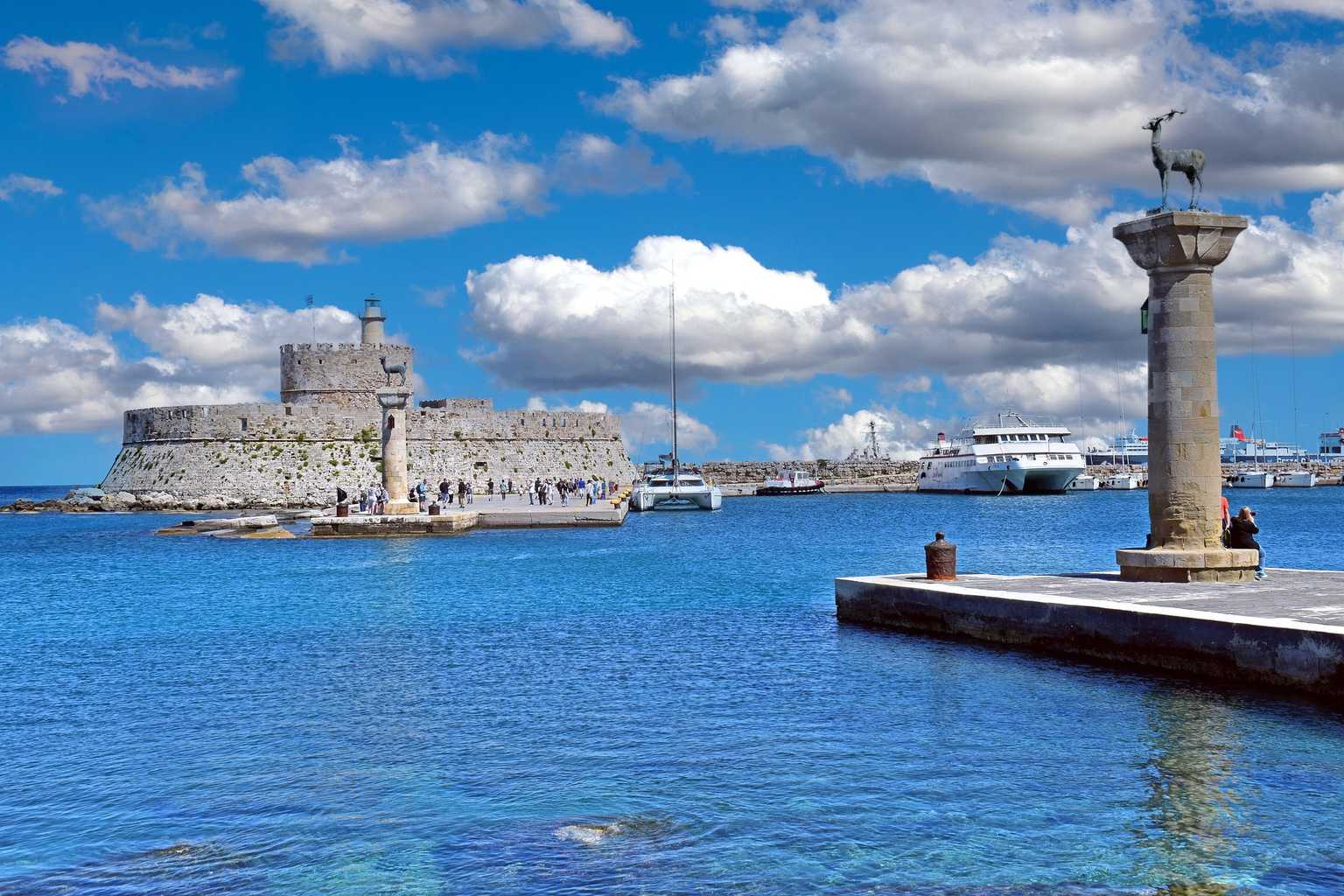 rhodes port lighthouse and deer statues