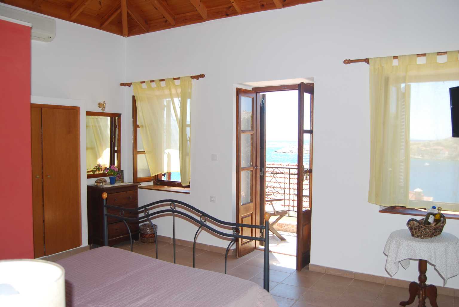 villa elena master bedroom looking at the balcony airconditioning