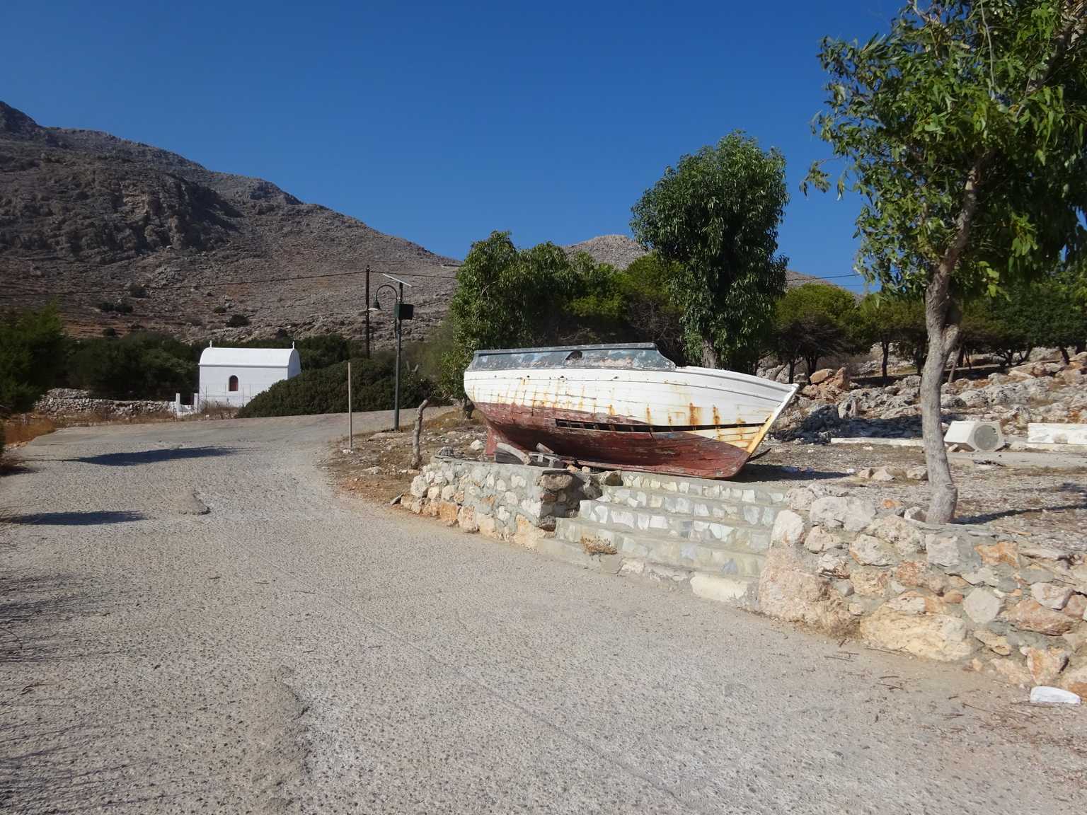 chalki leaving podamos beach boat on land